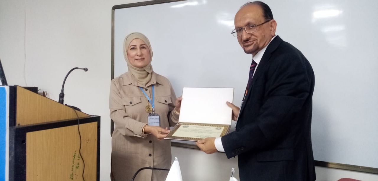 Discussion of a research paper at a conference by Assistant Professor Dr. Shatha Hussein Ali from the Pediatrics Department.