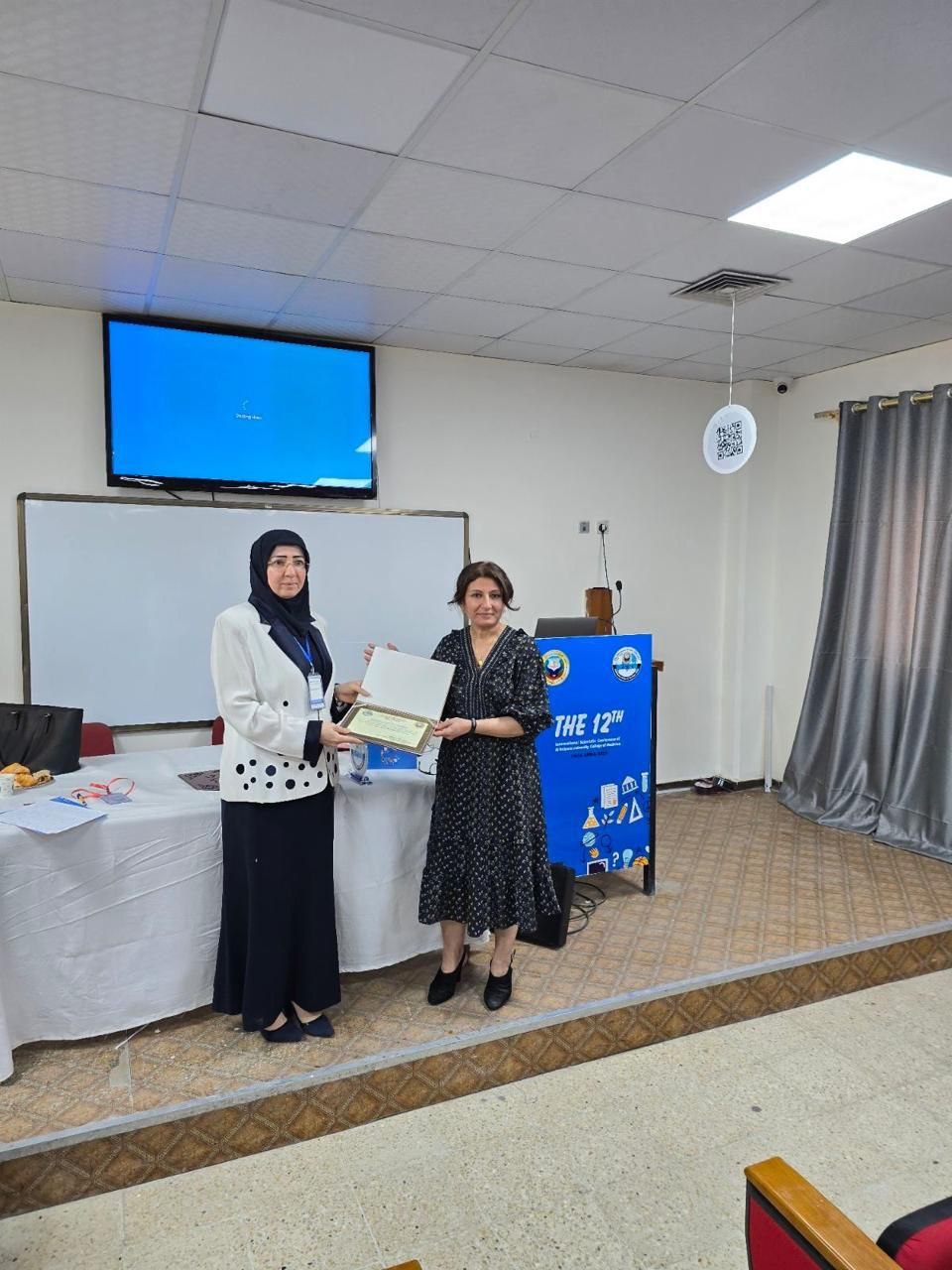 Honoring an expatriate consultant at the twelfth conference of Al-Nahrain College of Medicine